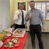 Two men at holiday party.