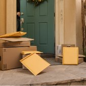 Image of front steps with packages and envelopes.