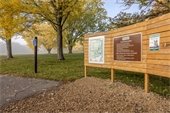 Photo of a trailhead outside with a map.