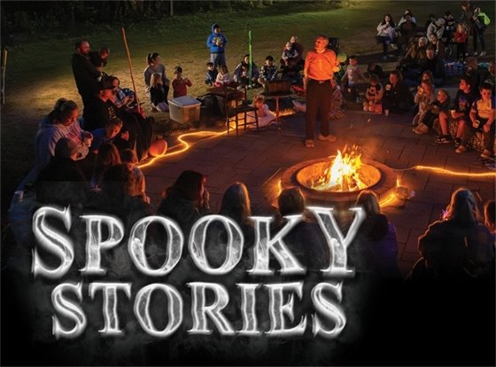 Banner Spooky Stories program around a campfire.