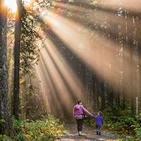 Man overlooking mountains with foggy sky Opens in new window